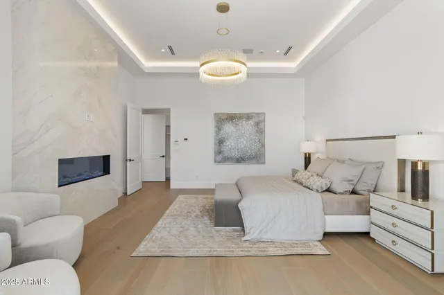 a bathroom with a sink a toilet a window and shower