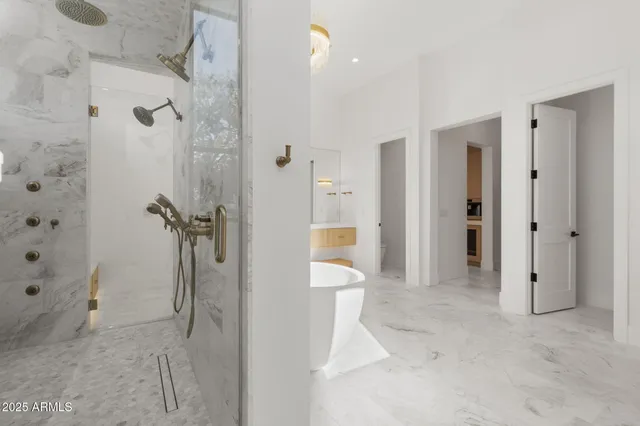 a bathroom with a double vanity sink toilet and shower