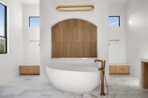 a living room with furniture and a projector screen