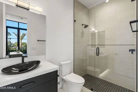 a living room with a sink and a mirror