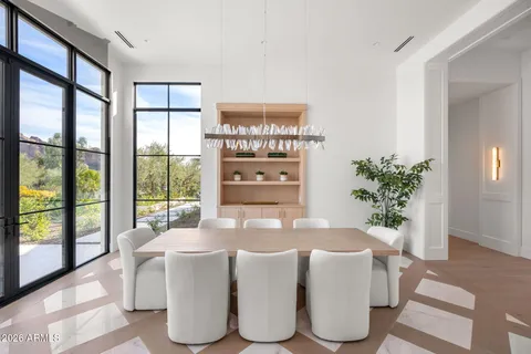 a dining room with furniture and window