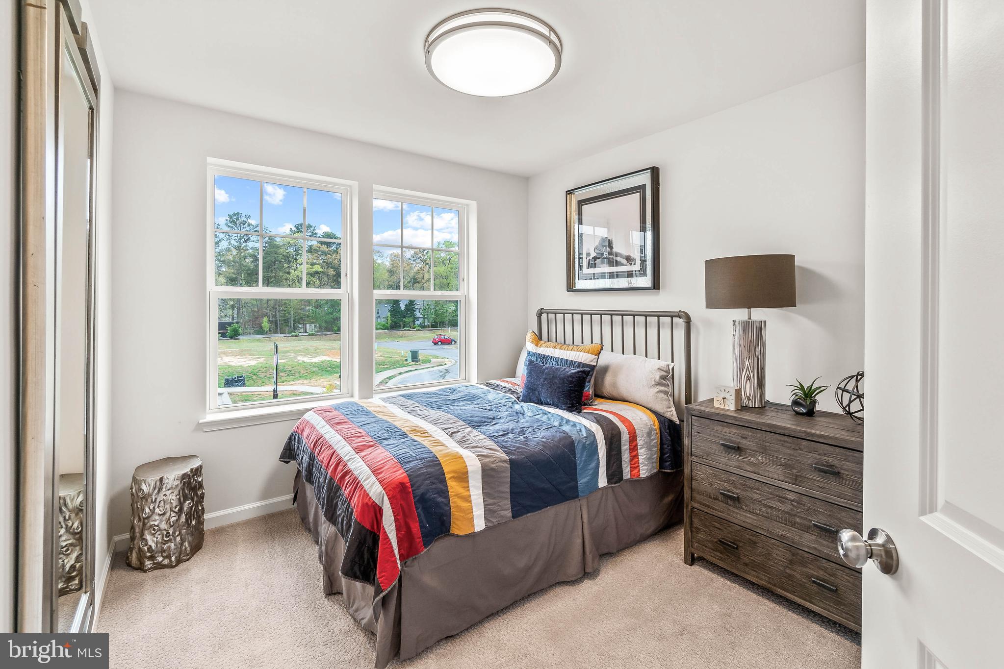 7033 Whispering Run Brandywine, MD 20613 - Photo 11 of 26 a bedroom with a bed and a window
