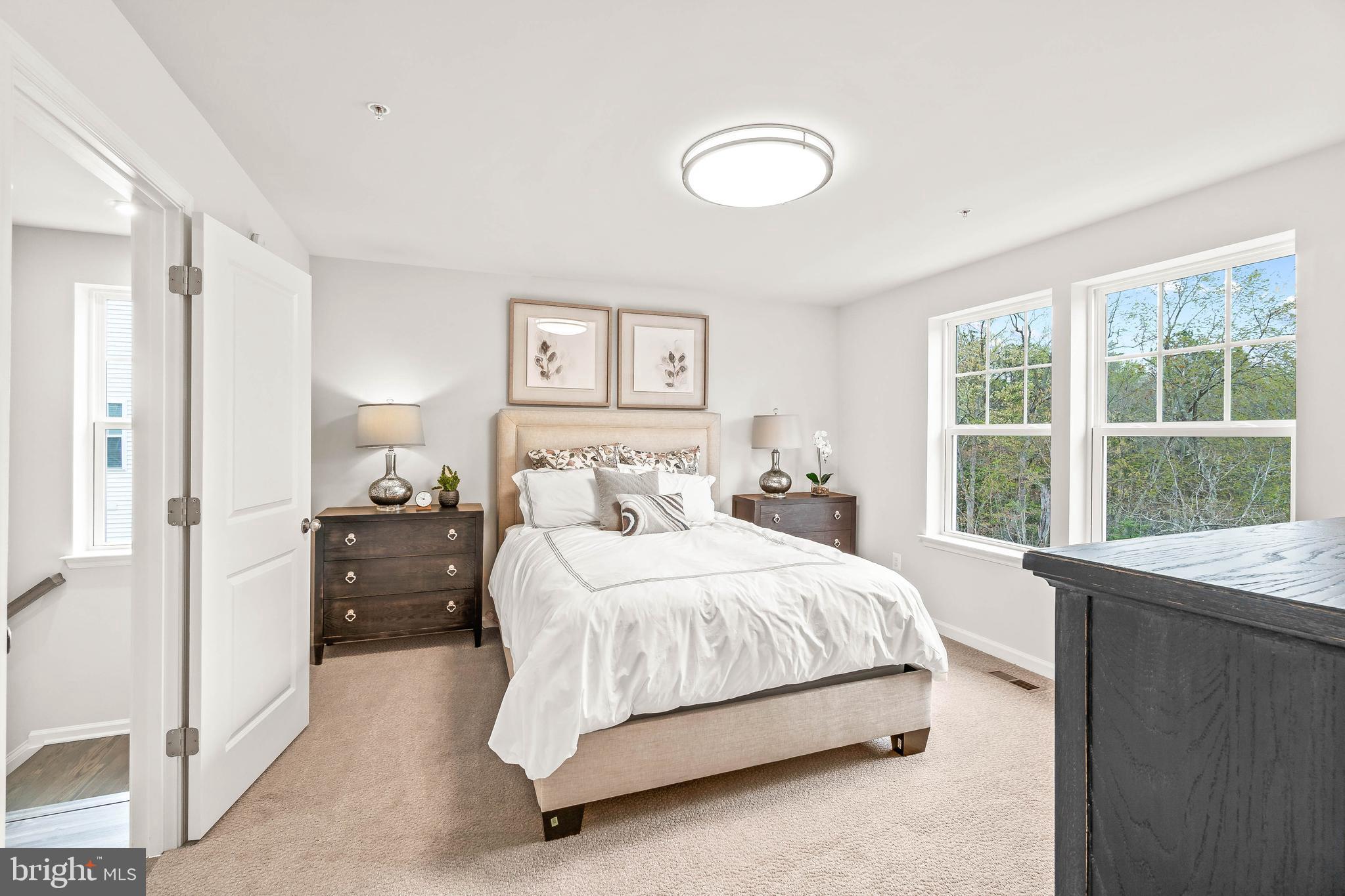 7033 Whispering Run Brandywine, MD 20613 - Photo 7 of 26 a bedroom with a bed and a large window