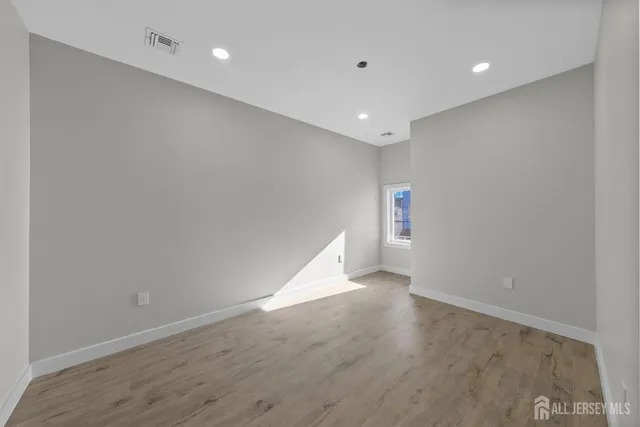 a view of a room with shelf on the wall
