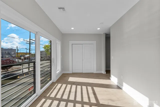 a bathroom with a sink toilet vanity and shower