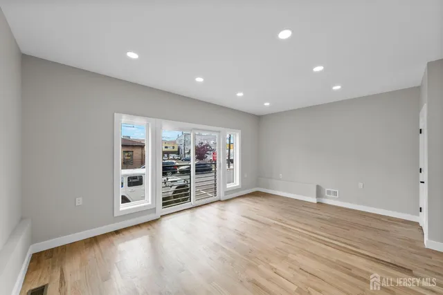 a spacious bedroom with a large bed and a window