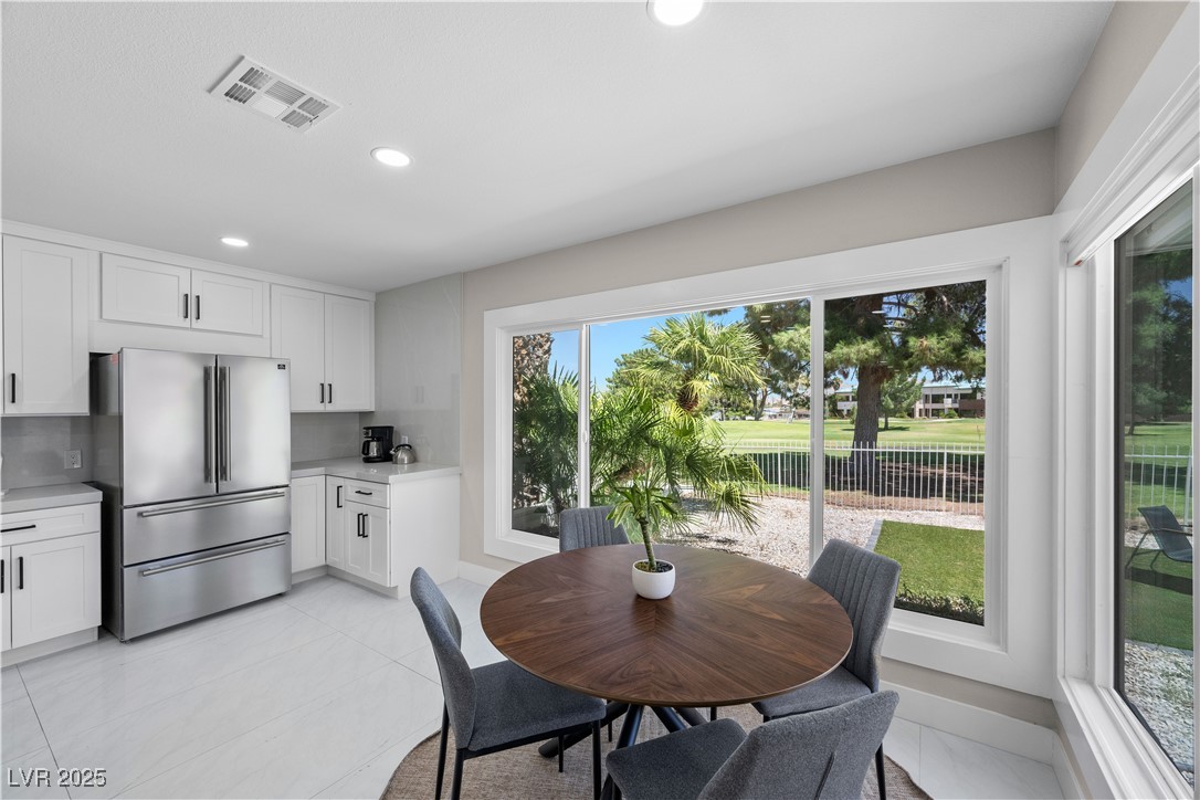 3482 Pueblo Way Las Vegas, NV 89169 - Photo 15 of 55 Charming breakfast area offers peaceful views of the golf course and private backyard — a perfect morning retreat.