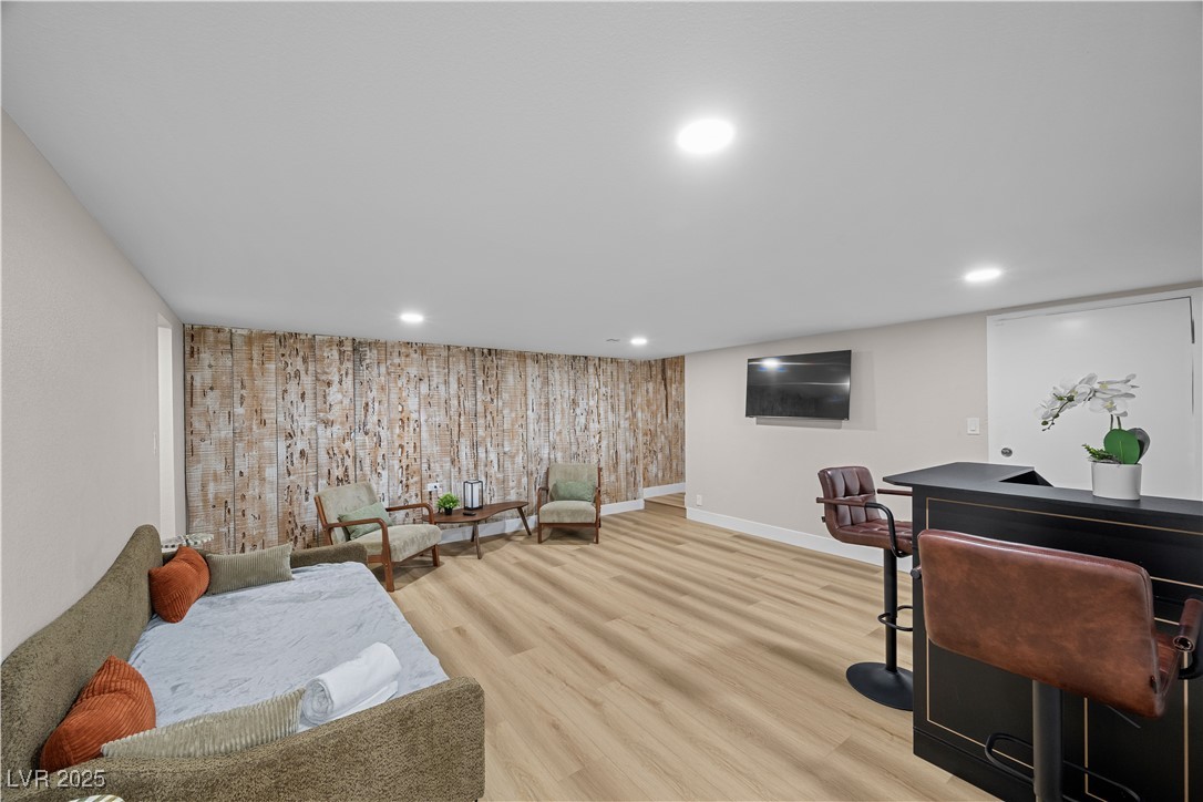 3482 Pueblo Way Las Vegas, NV 89169 - Photo 29 of 55 Ultimate entertainment zone featuring a wall-mounted TV and a sleek bar — ideal for movie nights and game day.