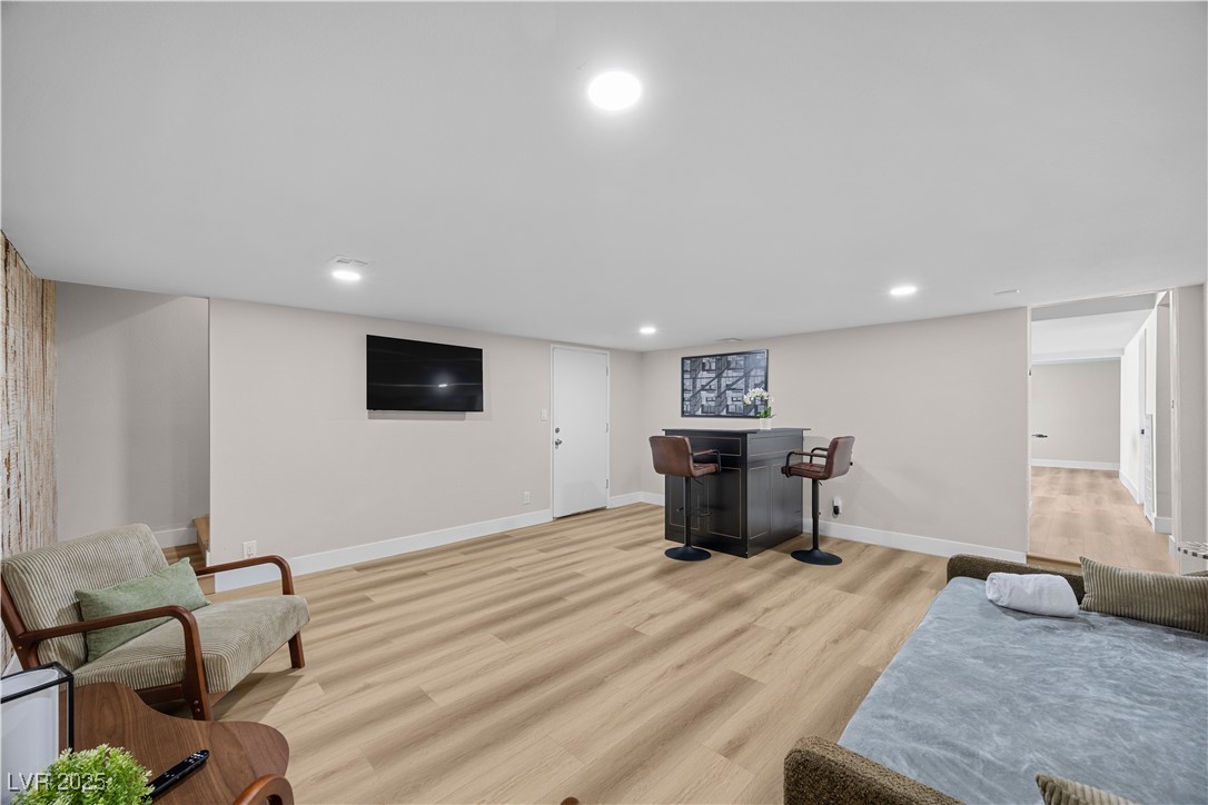 3482 Pueblo Way Las Vegas, NV 89169 - Photo 30 of 55 Cozy yet dynamic — this media space blends comfort and convenience with a full bar and entertainment-ready TV area.