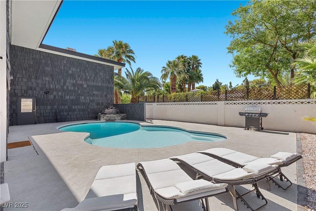 3482 Pueblo Way Las Vegas, NV 89169 - Photo 34 of 55 Relax by the sparkling pool in your own private oasis.