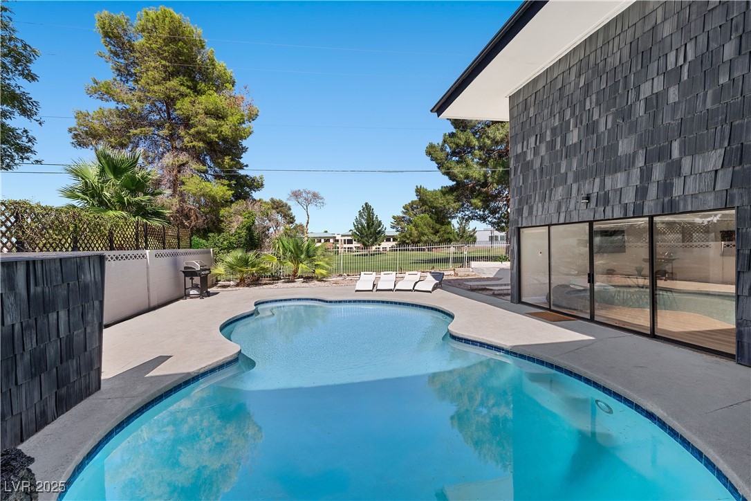 3482 Pueblo Way Las Vegas, NV 89169 - Photo 35 of 55 Dive into comfort with a beautifully maintained in-ground pool and views of the golf course!