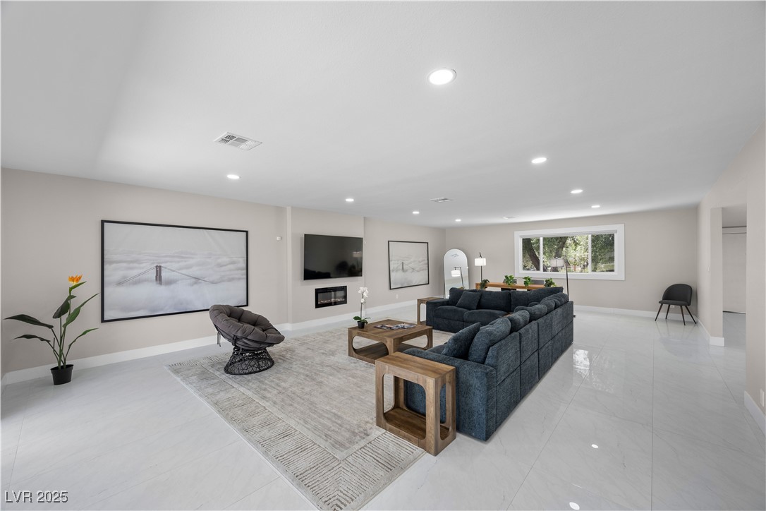 3482 Pueblo Way Las Vegas, NV 89169 - Photo 6 of 55 Elegant living space features abundant natural light and ideal for quiet mornings or lively gatherings.