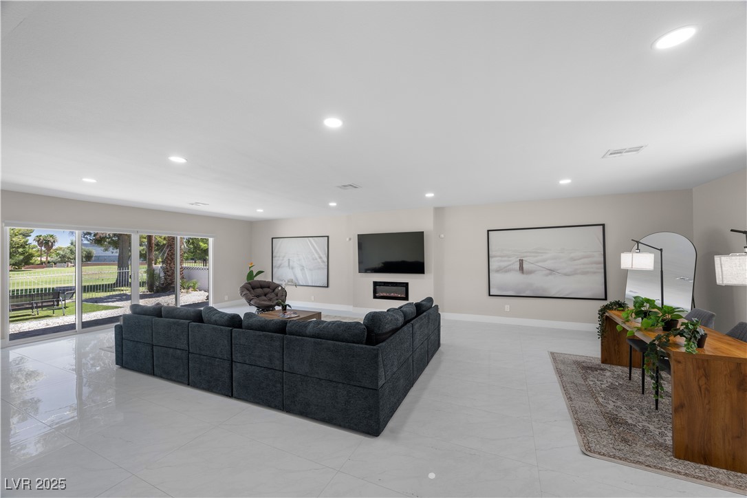 3482 Pueblo Way Las Vegas, NV 89169 - Photo 7 of 55 Enjoy the convenience of backyard access straight from this welcoming living room retreat.