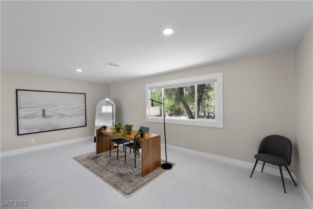 3482 Pueblo Way Las Vegas, NV 89169 - Photo 9 of 55 Whether for cozy evenings or relaxing afternoons, this living room delivers timeless comfort with plenty of seating space!