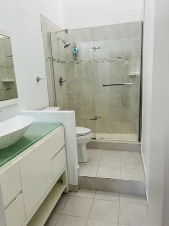 a view of hallway with wooden floor