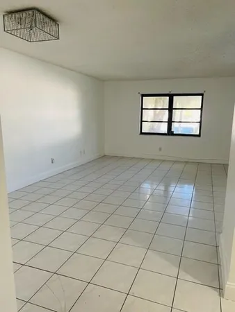 a view of an empty room and window