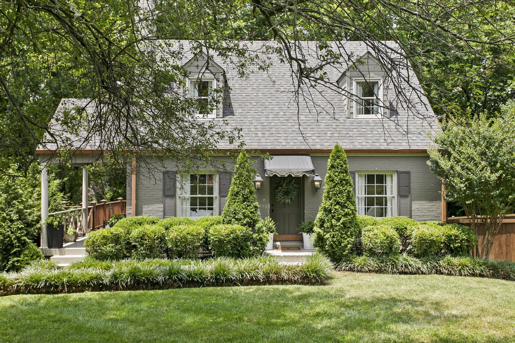 130 Spring Valley Road Nashville, TN 37214 - Photo 1 of 46 a front view of a house with a yard