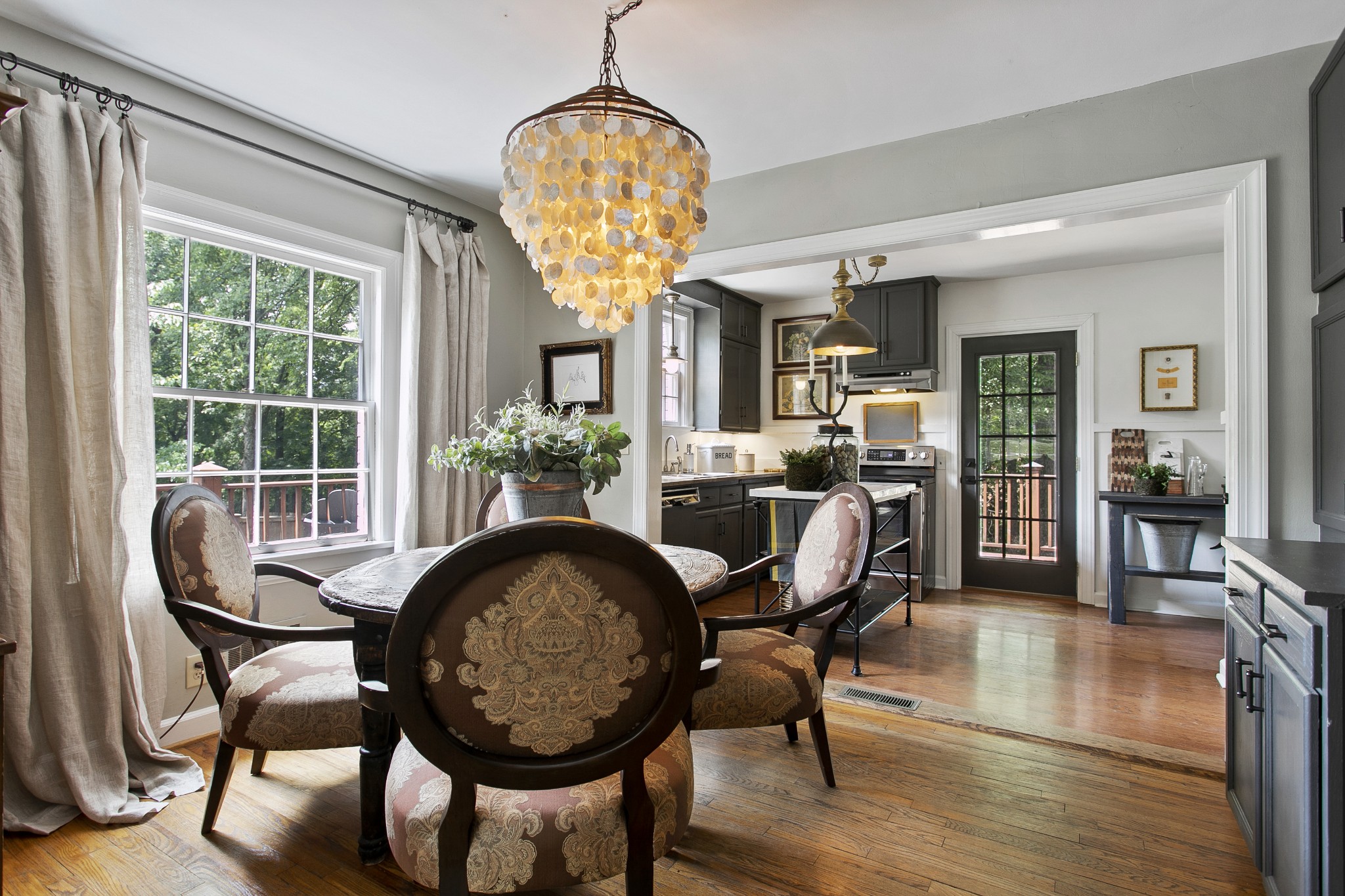 130 Spring Valley Road Nashville, TN 37214 - Photo 11 of 46 a dining room with furniture a chandelier and wooden floor