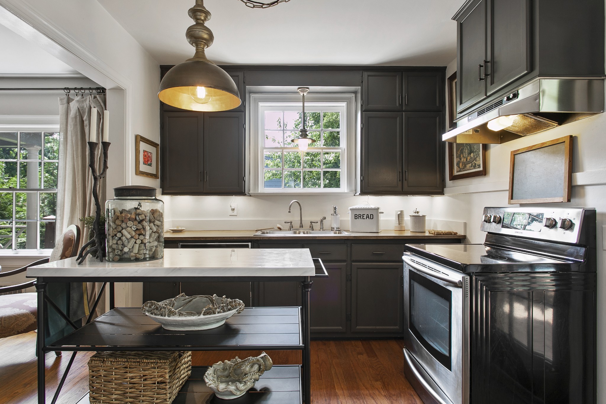 130 Spring Valley Road Nashville, TN 37214 - Photo 15 of 46 a kitchen with stainless steel appliances granite countertop a stove a sink and a refrigerator