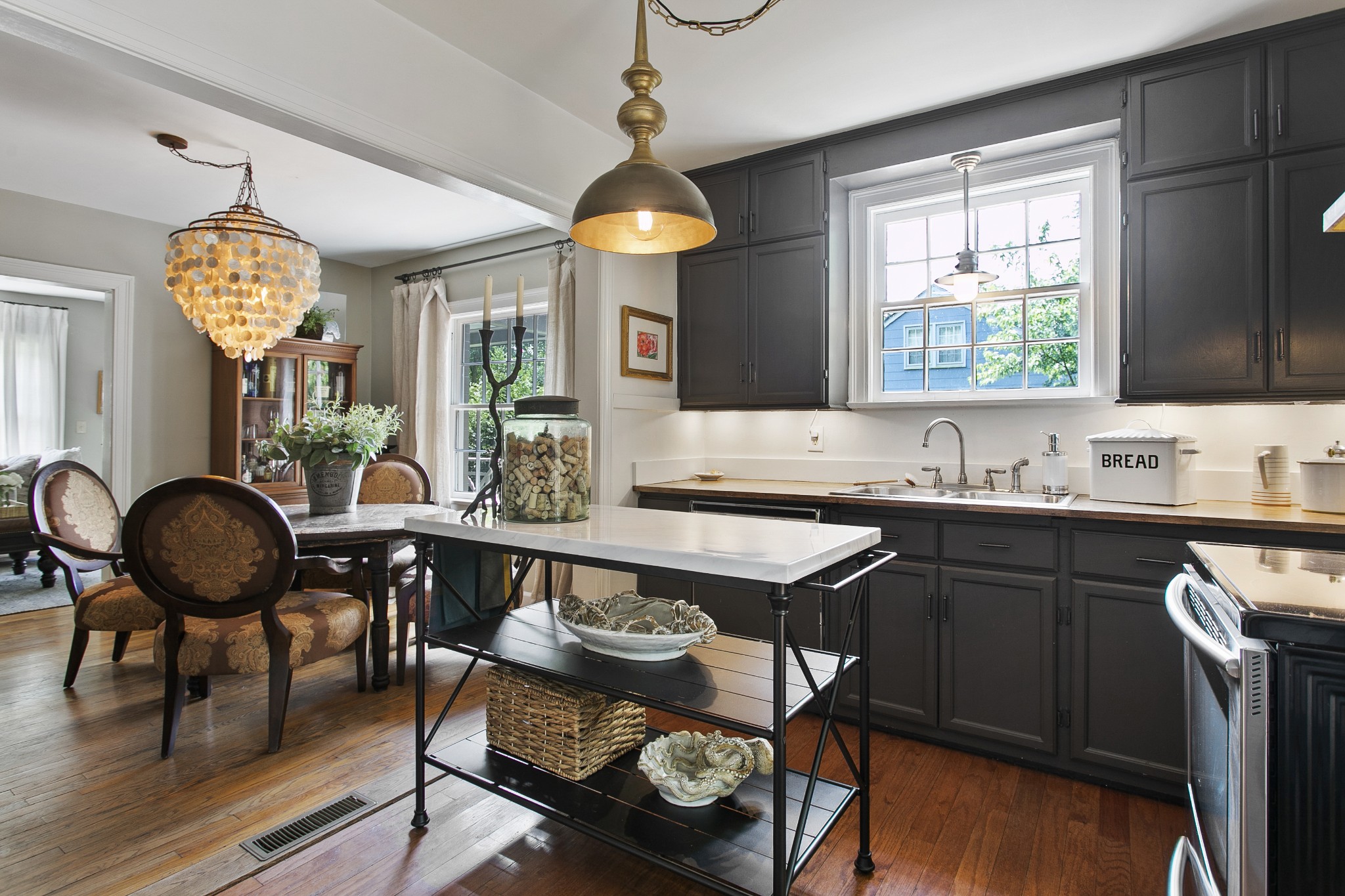 130 Spring Valley Road Nashville, TN 37214 - Photo 16 of 46 a view of a dining room with furniture window and wooden floor