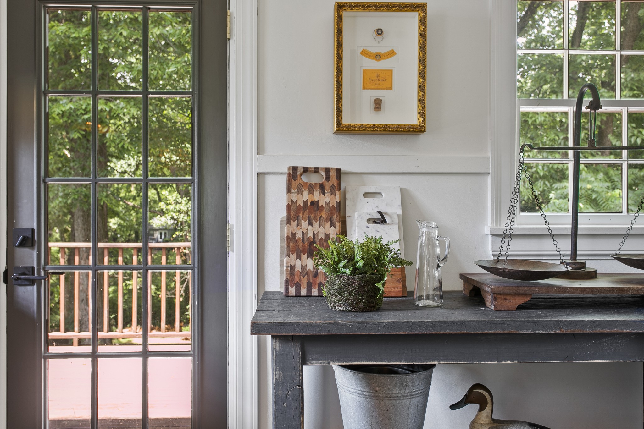 130 Spring Valley Road Nashville, TN 37214 - Photo 17 of 46 a table with a vase and flowers on it