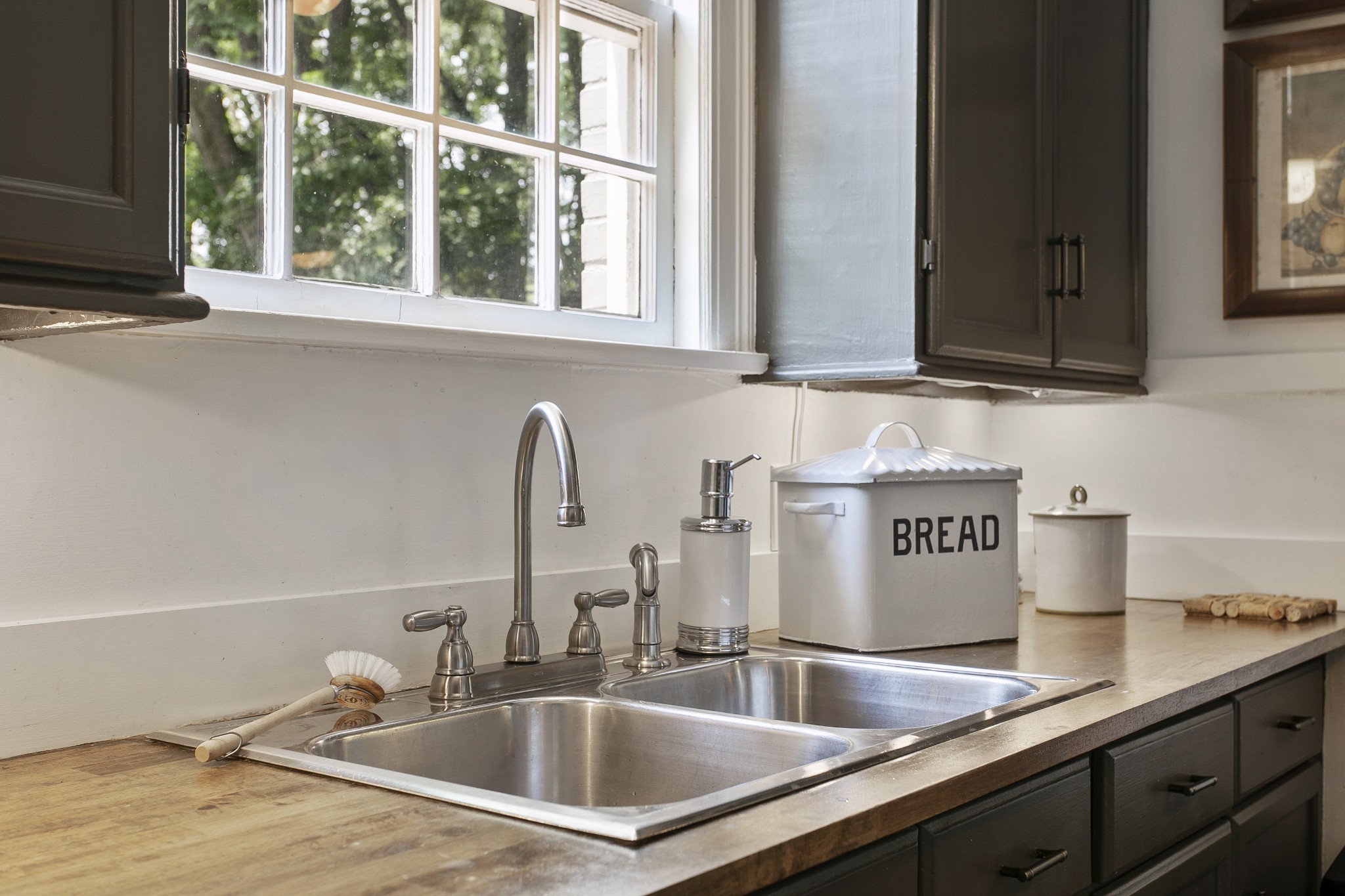 130 Spring Valley Road Nashville, TN 37214 - Photo 18 of 46 a kitchen with sink a faucet and a window