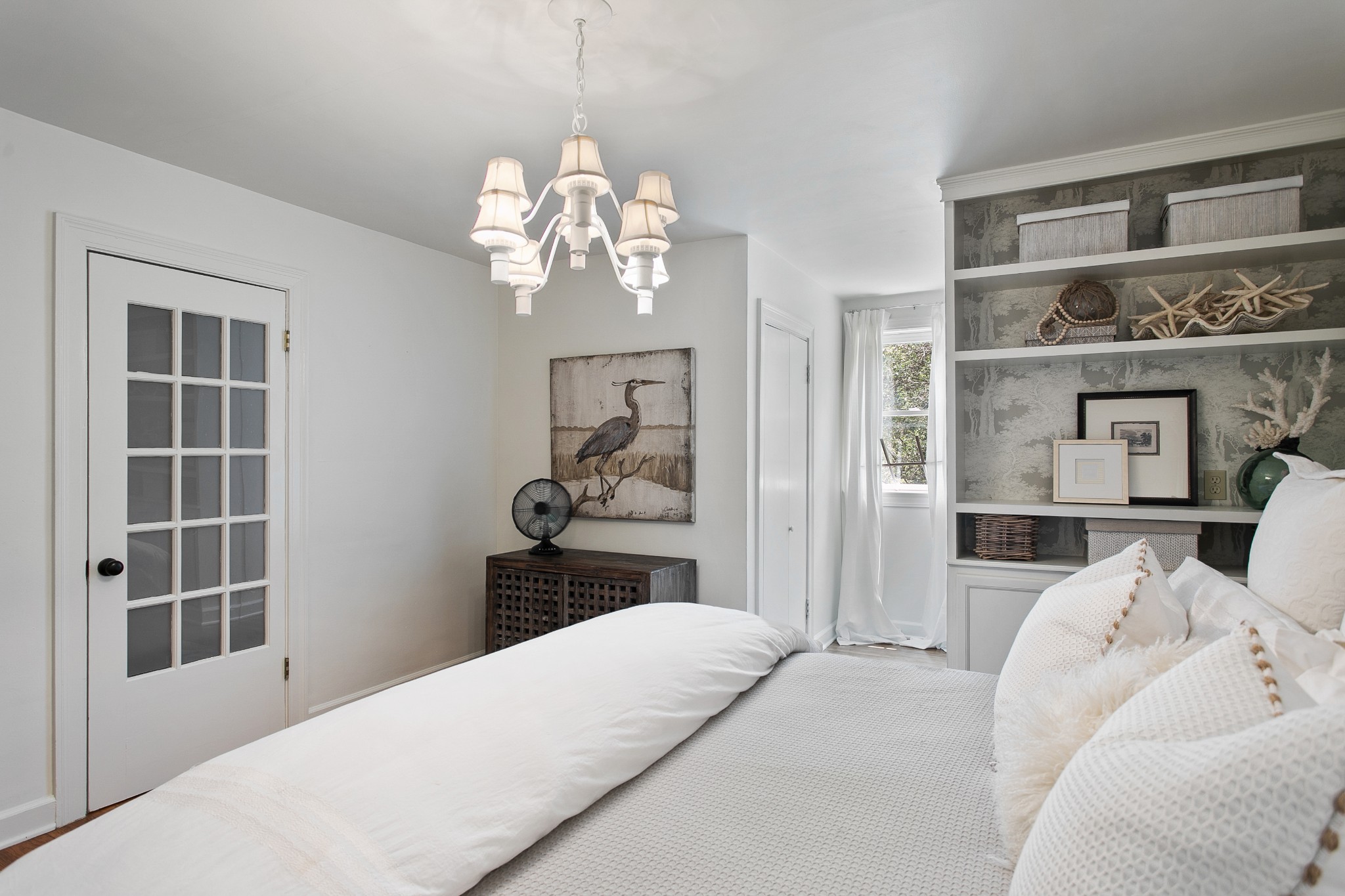 130 Spring Valley Road Nashville, TN 37214 - Photo 25 of 46 a bedroom with a large bed and a chandelier