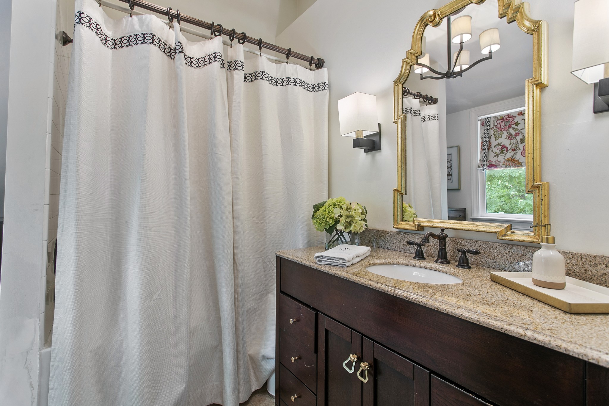 130 Spring Valley Road Nashville, TN 37214 - Photo 28 of 46 a bathroom with a granite countertop sink and a mirror