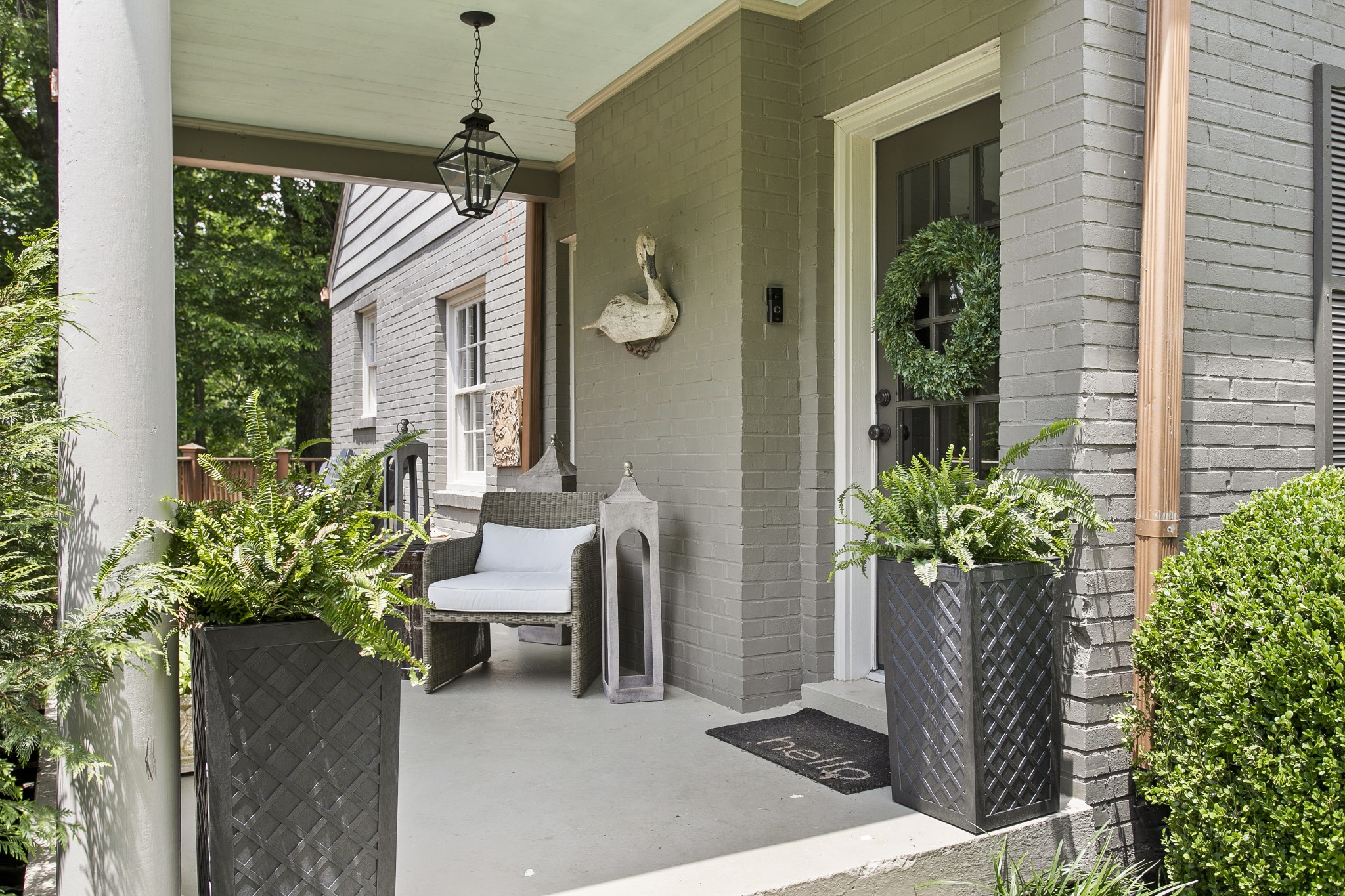 130 Spring Valley Road Nashville, TN 37214 - Photo 4 of 46 a view of a porch with chairs and potted plants