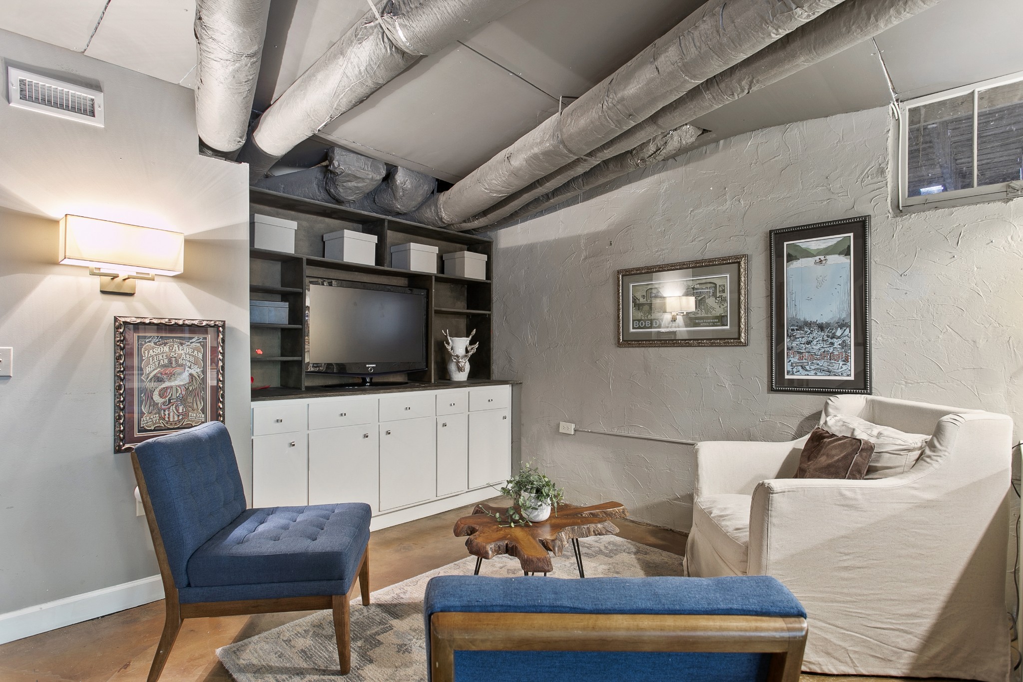 130 Spring Valley Road Nashville, TN 37214 - Photo 32 of 46 a living room with furniture and a flat screen tv