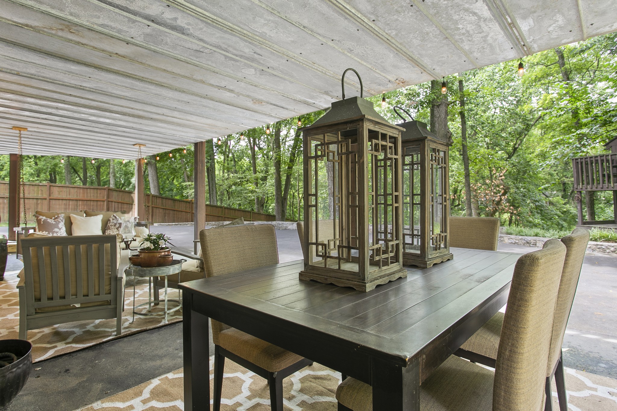 130 Spring Valley Road Nashville, TN 37214 - Photo 35 of 46 a view of a patio with a table chairs and a backyard