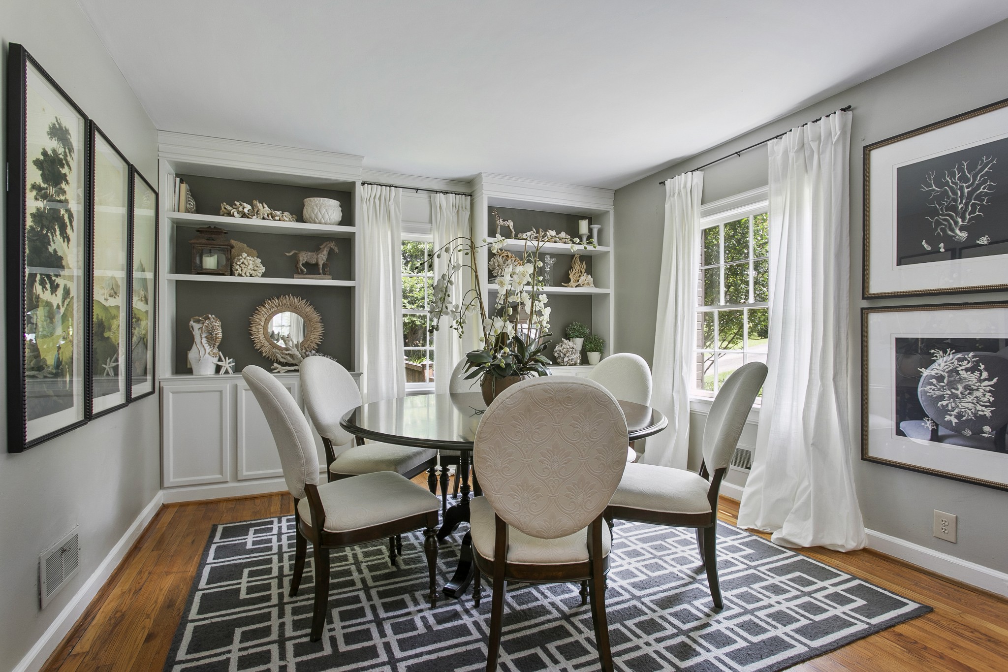 130 Spring Valley Road Nashville, TN 37214 - Photo 8 of 46 a view of a dining room with furniture window and wooden floor