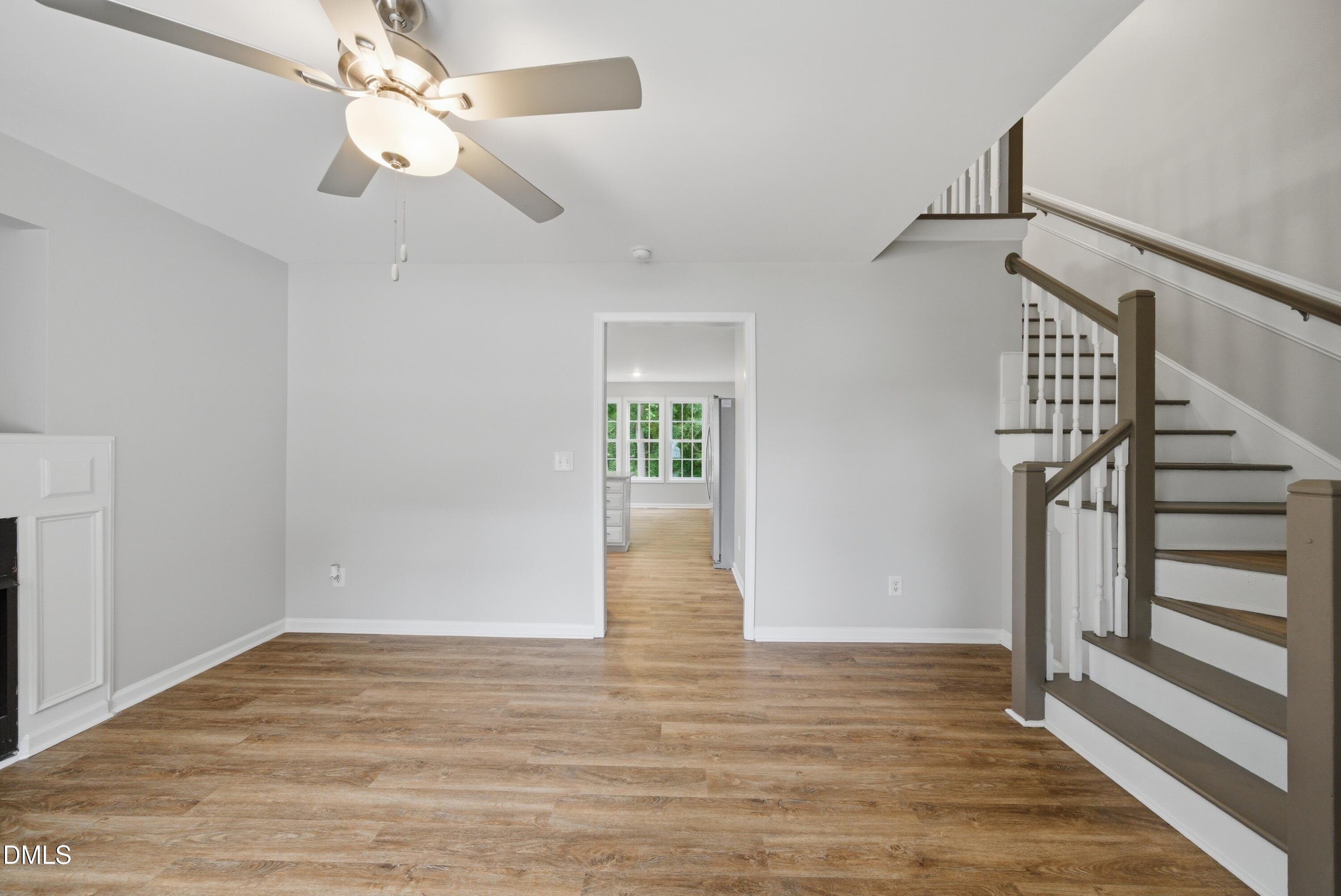 201 Tonylee Court, Unit A Raleigh, NC 27603 - Photo 7 of 30 wooden floor in an empty room with a window