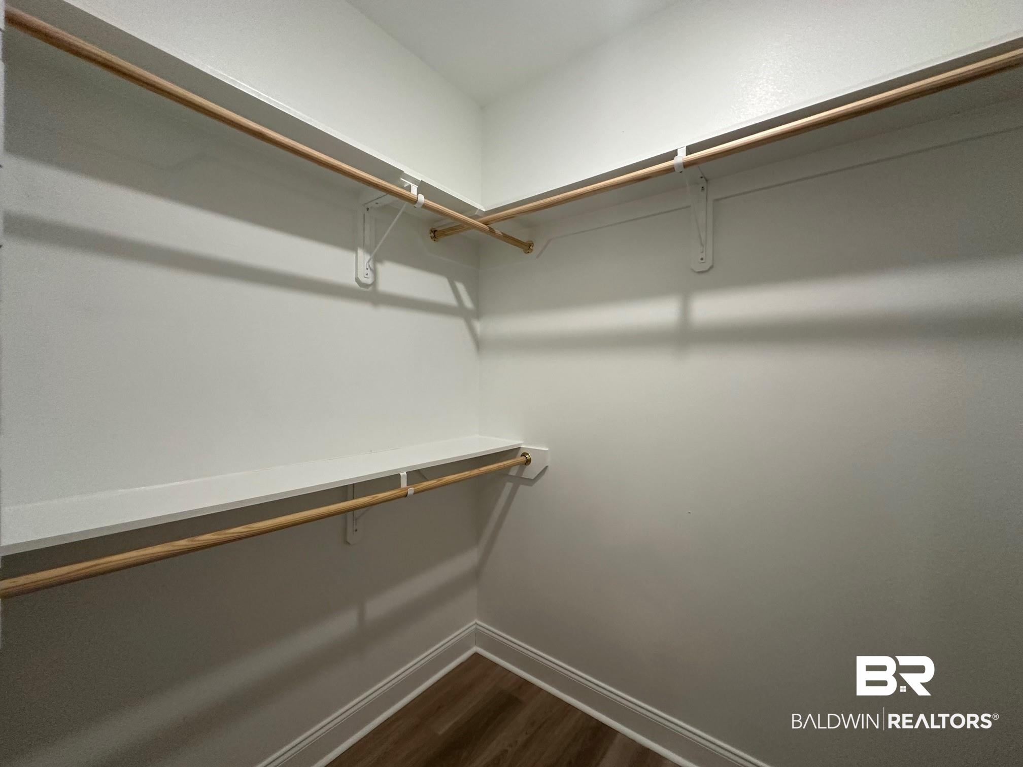 1009 Ruisseau Drive Foley, AL 36535 - Photo 45 of 55 Walk in closet featuring dark wood-type flooring