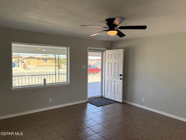 a view of an empty room with a window