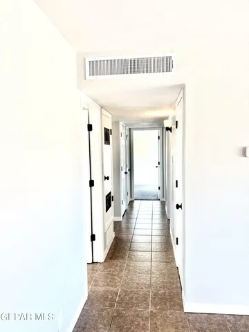 a view of a hallway with a white walls