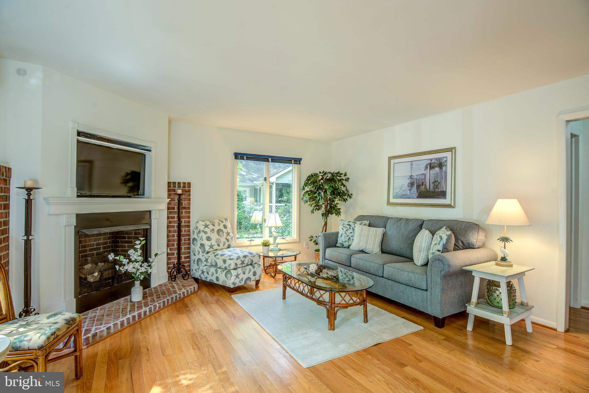 19 Capetown Road Ocean Pines, MD 21811 - Photo 2 of 56 a living room with furniture and a fireplace