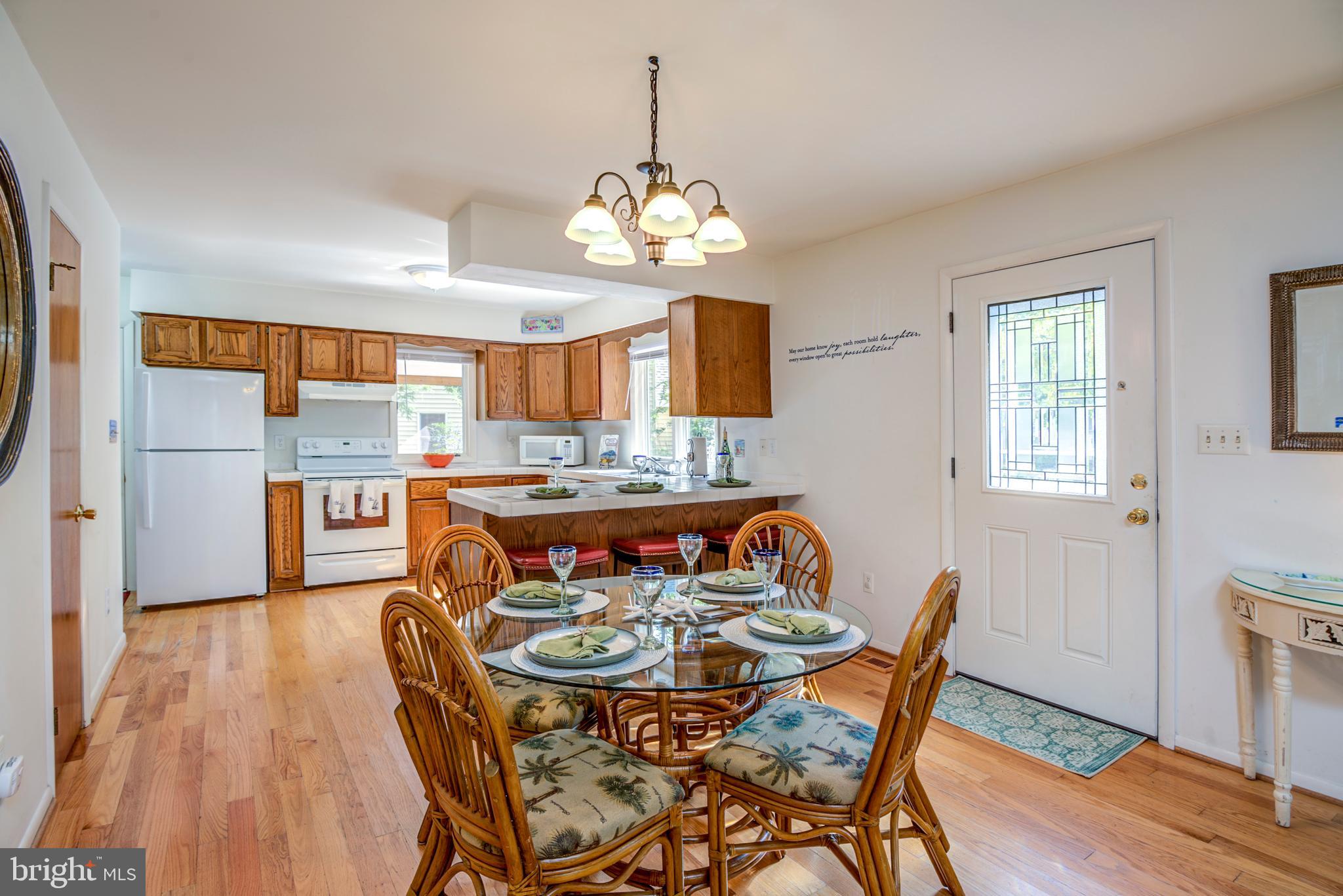 19 Capetown Road Ocean Pines, MD 21811 - Photo 24 of 56 a view of a dining room with furniture window and wooden floor