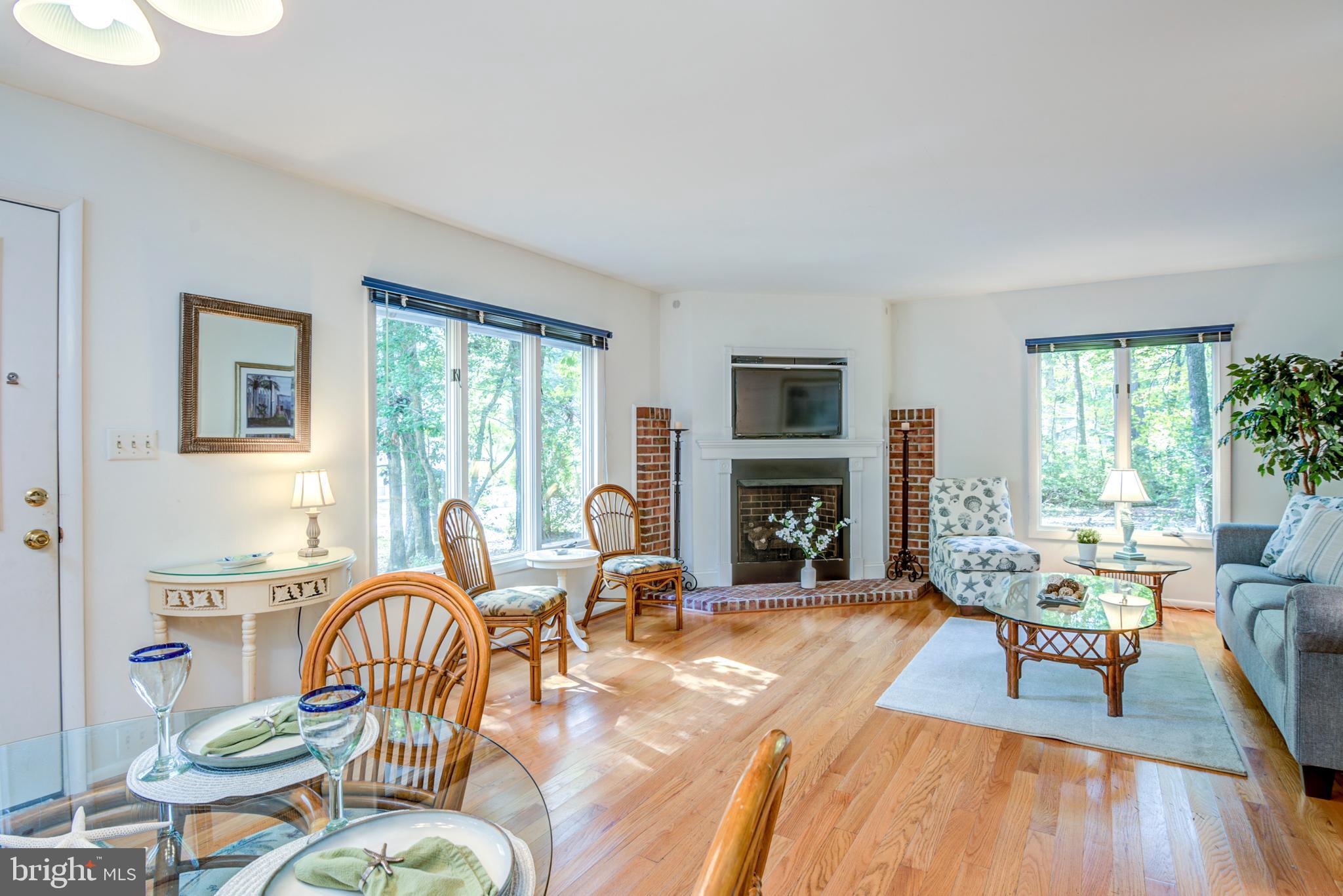 19 Capetown Road Ocean Pines, MD 21811 - Photo 26 of 56 a living room with fireplace furniture and a large window