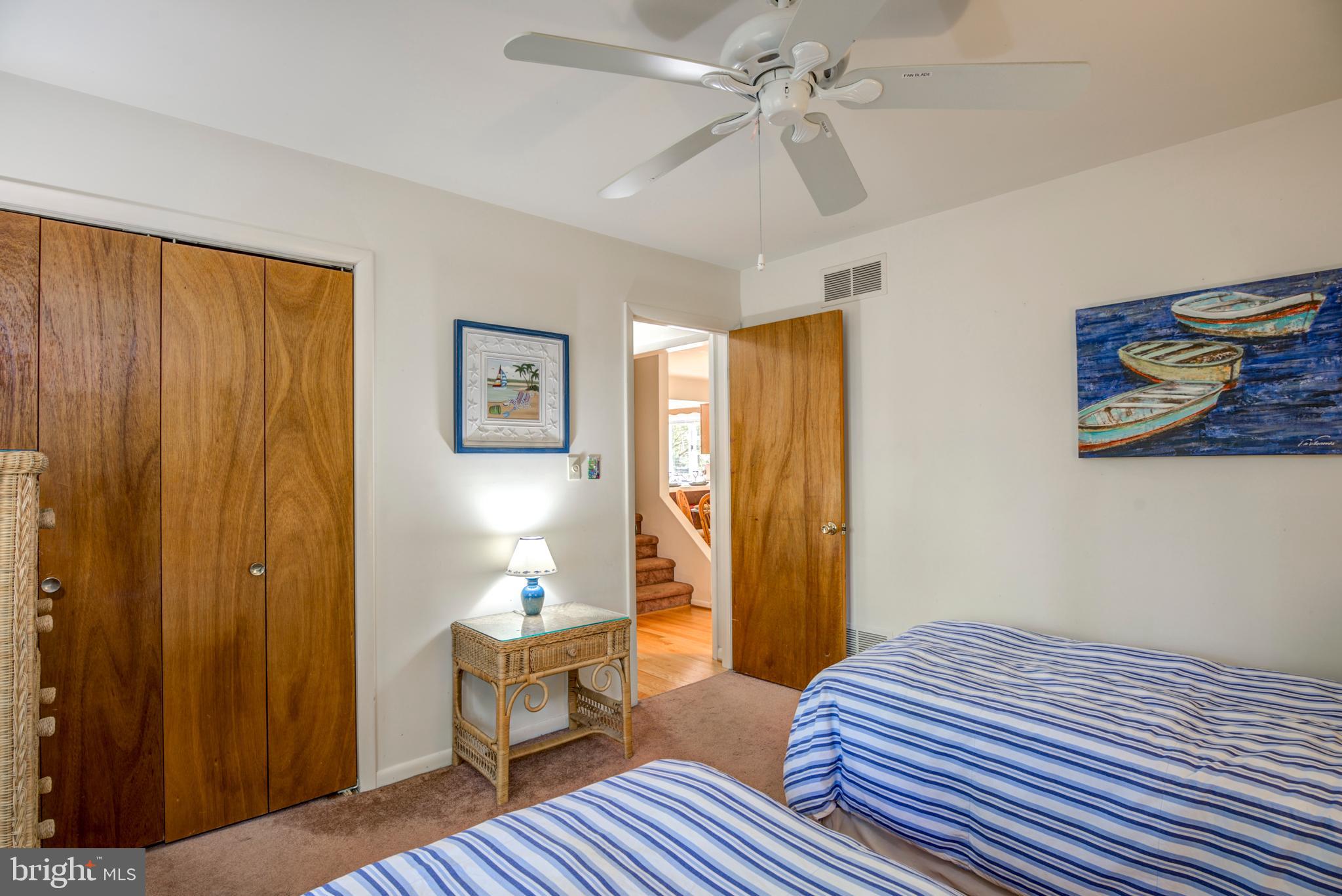 19 Capetown Road Ocean Pines, MD 21811 - Photo 31 of 56 a bedroom with a bed and wooden floor