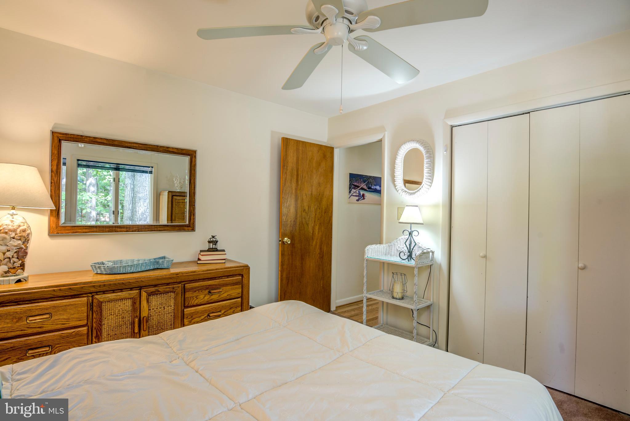 19 Capetown Road Ocean Pines, MD 21811 - Photo 32 of 56 a bedroom with a bed and a chandelier