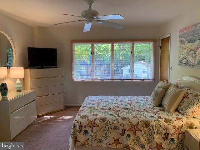 19 Capetown Road Ocean Pines, MD 21811 - Photo 42 of 56 a bedroom with a bed and a flat screen tv
