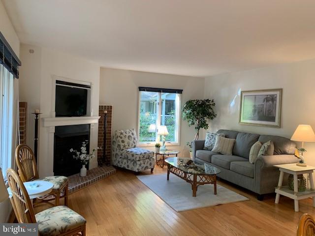 19 Capetown Road Ocean Pines, MD 21811 - Photo 56 of 56 a living room with furniture a window and a fireplace