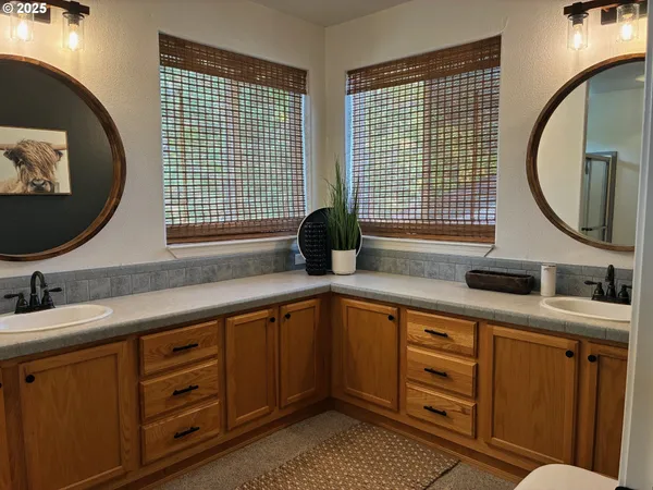 a kitchen with a sink and a mirror