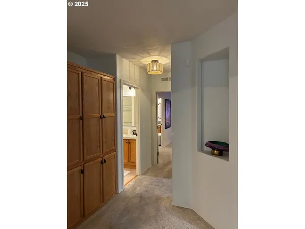 a view of a bathroom with a shower and a sink