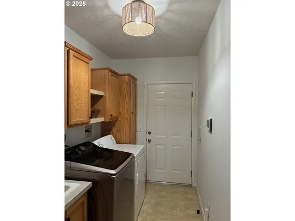 a kitchen with a sink cabinets and appliances