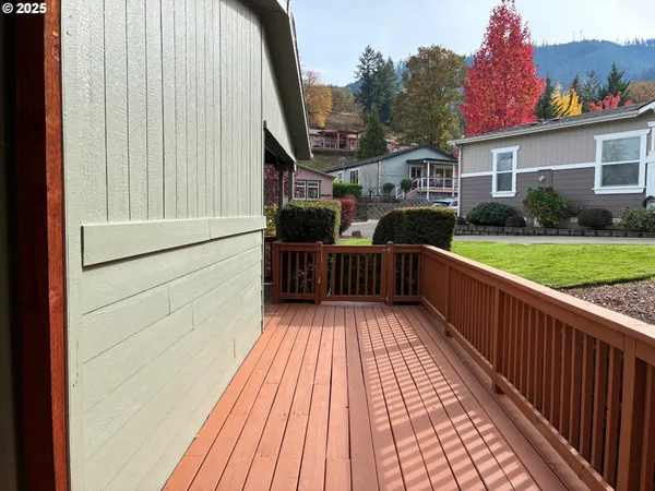 a balcony with furniture and a potted plant