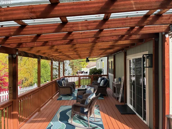 a view of balcony with wooden floor