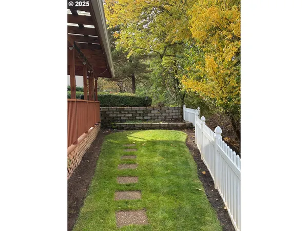 a view of a house with a small yard
