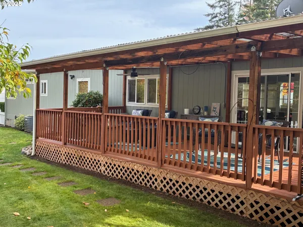 a front view of house with yard outdoor seating and barbeque oven